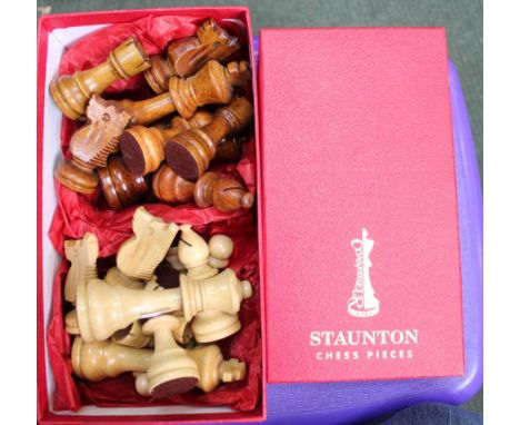 A complete boxed set of Staunton chess pieces