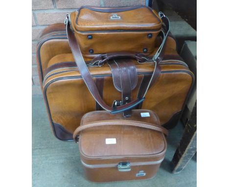 An Antler set of cases; two suitcases, a vanity case and a shoulder bag **PLEASE NOTE THIS LOT IS NOT ELIGIBLE FOR IN-HOUSE P