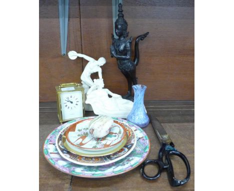 A H. Samuel carriage clock, a large pair of tailor's scissors, a famille verte plate, other plates, an onyx egg, two figures,