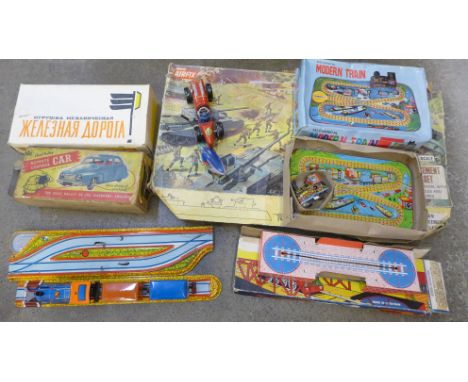 A collection of tin plate toys including Chad Valley, boxed and an Airfix gun emplacement assault set 