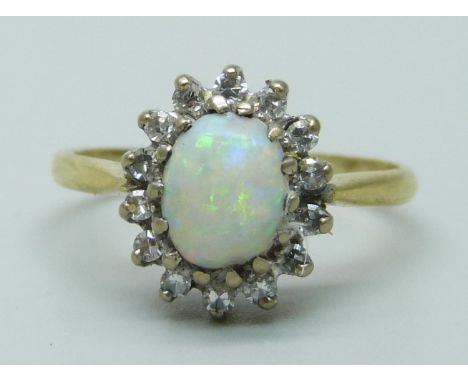 An 18ct gold opal and diamond cluster ring, 3.4g, M 