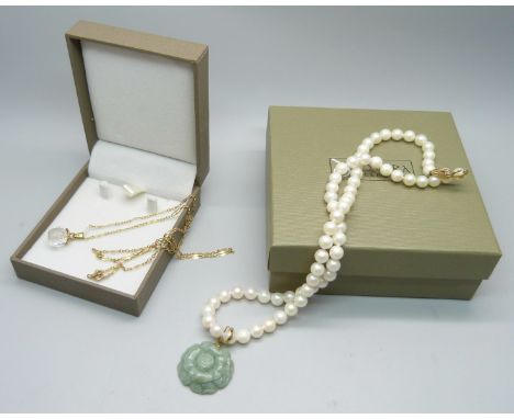 A 9ct gold and crystal pendant and chain, (chain 2.1g) and a pearl necklace with jade pendant and 14ct gold clasp and hanger 