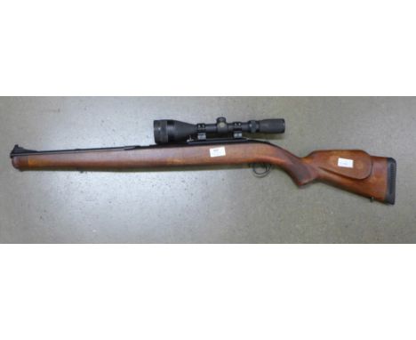 A 1992 B.S.A. Stutzen .22 rotary breech, 11.2 foot pounds, manual safety, and Simmons Whitetail scope 4 x 12-44