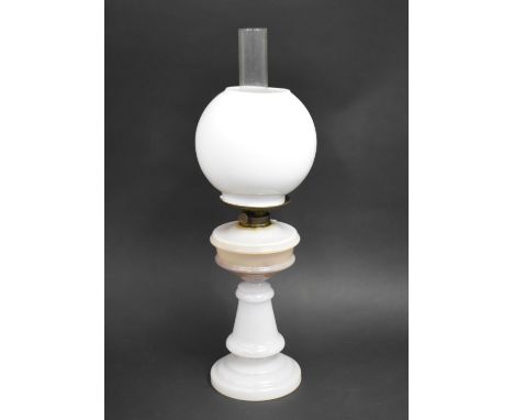 An Opaque Glass Based Oil Lamp with Globular Shade, 58cms High 