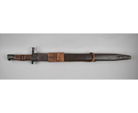 An American WWI 1917 Bayonet by Remington Stamped US and with Flaming Grenade, Grooved Wooden Slab Grip complete with Steel a