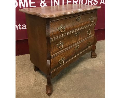 A 19th Century Dutch style bombe shaped petit commode 