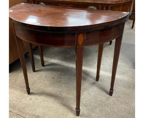 A George III inlaid mahogany demi lune fold over card table 