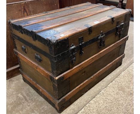 An early 20th Century oak and iron bound trunk 