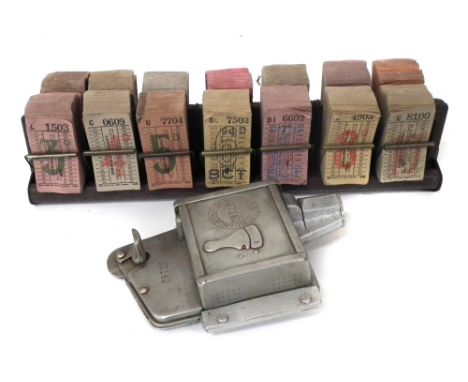 Bell Punch bus ticket stamp no. 27142, together with a ticket rack and unused tickets.