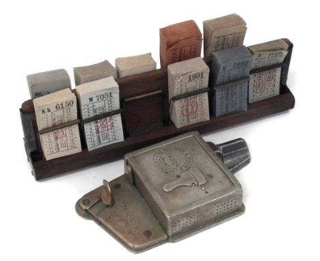 Bell Punch bus ticket stamp no. 76504, together with a ticket rack and unused tickets.