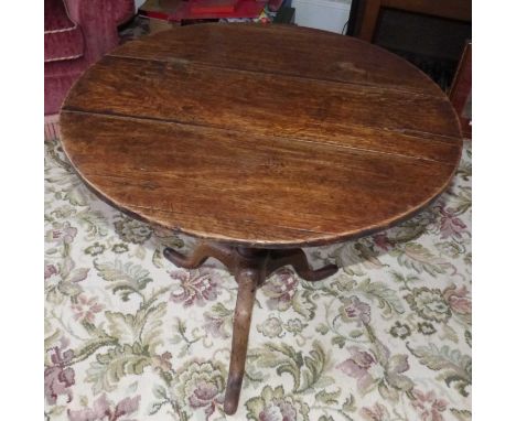 George III oak tripod table. Condition reports are not available for our Interiors Sales.
