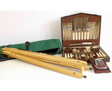Mounted TR2 Triumph car badge, artists easel and canteen of cutlery. Condition reports are not available for our Interiors Sa