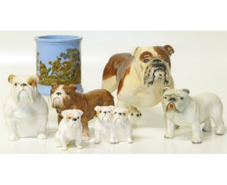 A group of ceramic bulldogs by Beswick and other makers (6 items) and one other ceramic pot. Condition reports are not availa