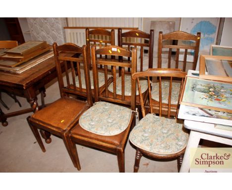 Five oak slat back chairs; and a Ibex stick back chair 