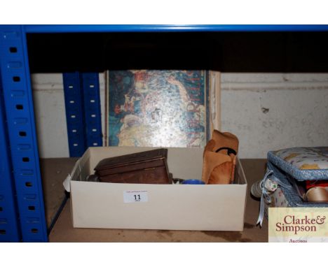 A box containing a trinket box, paperweight, pair of opera glasses, a Royal Worcester wren ornament, and a vintage Cinderella