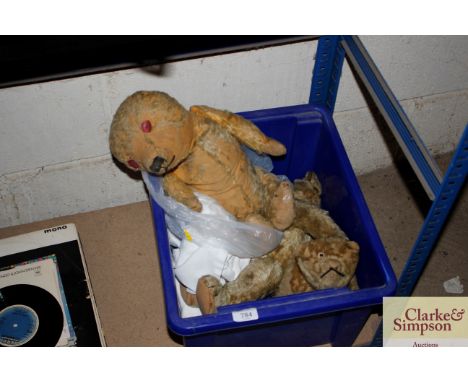 A box containing various well loved Teddy bears