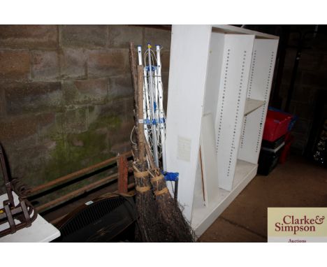 Three brooms; and a rotary washing line 