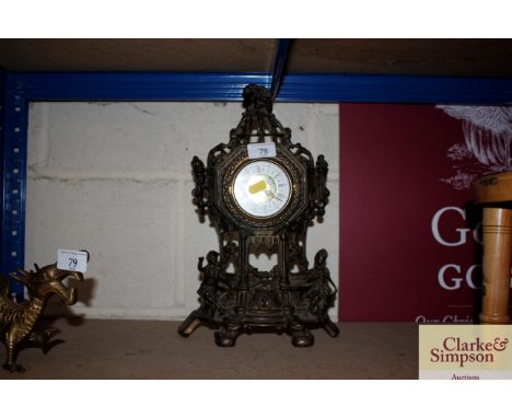 A mantel clock decorated with figures 