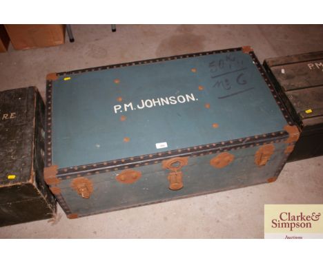 A leather and metal bound travelling trunk