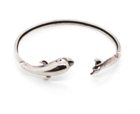 A large sterling silver dolphin bangle marked 925. Approx weight 15 grams, inside width 70mm