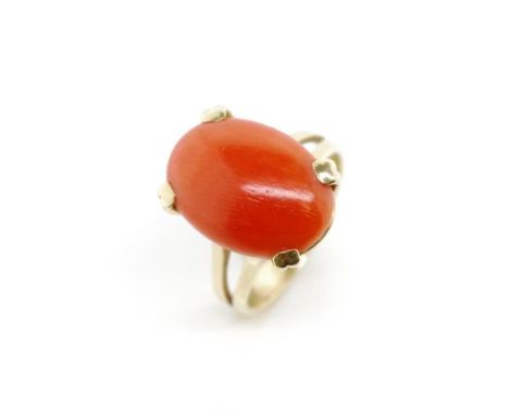 Coral and 18ct yellow gold ring marked 18ct. Approx weight 5 grams, ring size K-L, 15mm x 11mm cabochon size