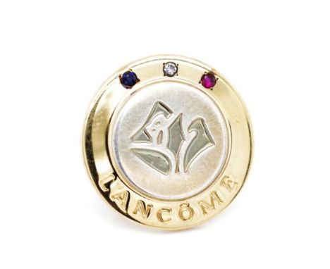 Silver and gold Lancome badge By Tiffany &amp; Co marked 18k on Sterling SIlver Tiffany &amp; co. Set with a diamond, sapphir