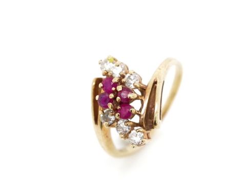 Diamond and ruby set 9ct rose gold ring marked 9ct. Approx weight 2.7 grams, ring size K