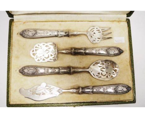 Vintage French cased silver serving set four pieces of silver serving utensils, each with decorative bowls, tines, and blade,