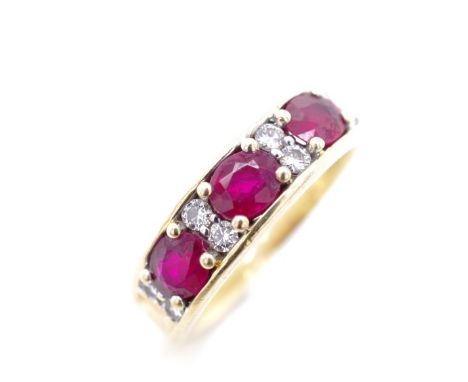 Ruby and diamond set 18ct yellow gold ring marked 750. Approx weight 6.3 grams, ring size L