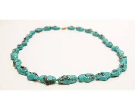 Strand of vintage turquoise coloured glass beads length 34cm approx