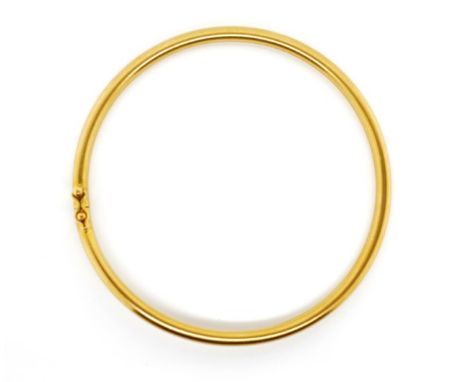 22ct yellow gold bangle marked 916 to round hollow tube approx 3mm gauge, inside width of bangle 56mm, weight 13 grams. With 