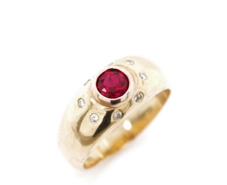 Diamond and ruby set 18ct yellow gold ring marked 750. Approx weight 9 grams, ring size P