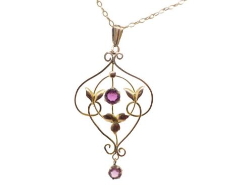 Art Nouveau 9ct yellow gold pendant and chain set with amethyst glass. Marked 9ct to pendant and rubbed marks to chain. Appro