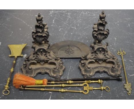 Pair of Victorian cast iron fire dogs and assorted fire tools