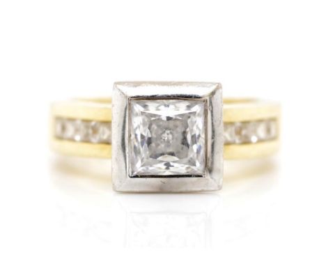 Cubic zirconia and 18ct two tone gold ring marked 750. Approx weight 8.9 grams, ring size L-M