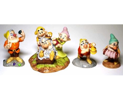 Four Royal Doulton "Snow White" figurines to include Grumpy's bath time, dear old Doc, Doc with lantern, and Bashful's melody