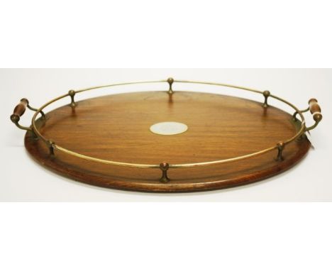 Vintage oak serving tray oval shaped tray, with raised silver plate railed gallery, and central oval shield, monogrammed. (Le