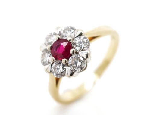 Ruby and diamond 18ct yellow gold cluster ring marked 750. Approx weight 4.3 grams, ring size I, ring weight 4.2 grams.