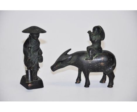 Two vintage Chinese cast metal figures including a figure on a water buffalo, 11cm high (tallest) approx.