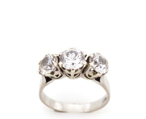 Three stone 18ct white gold ring set with cubic zirconia. Marked 18ct. Approx weight 4 grams, ring size O