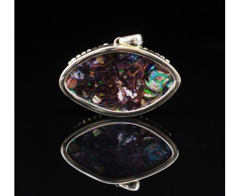 Boulder opal and yellow gold pendant with a 14ct yellow gold setting and 18ct gold applied medusa's head masks. Marked 585 / 