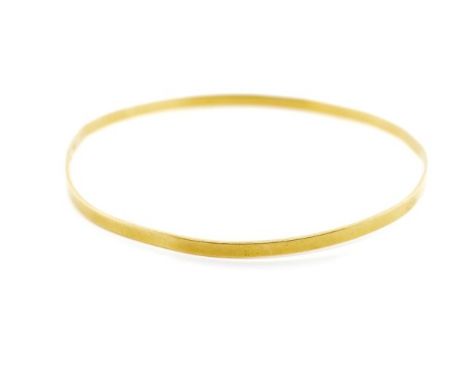 Yellow gold bangle 2.5mm flat wire in brushed finished for reshaping. Marked 750. Approx weight 7.69 grams, inside width 62mm