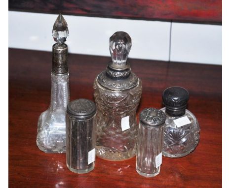 Five various vintage toilet jars some with sterling silver tops, 19cm high (tallest) approx.