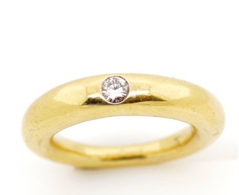Solitaire diamond set 18ct yellow gold ring marked 750. Approx weight 13.1 grams, ring size L-M