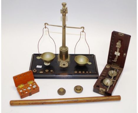 Two sets of vintage measuring scales together with a boxed set of weights, eight brass weights, and a wooden rule, height 26c