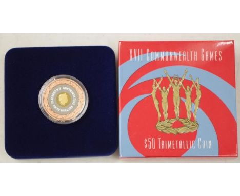 Australian 2002 Commonwealth Games $50 coin tri metal composition, proof, the centre 24ct gold, the inner ring pure silver an