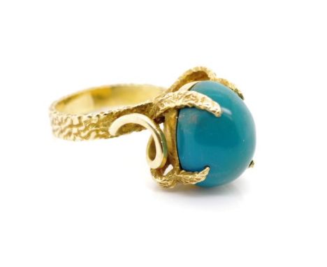 18ct yellow gold and blue gemstone ring marked 18ct. Approx weight 8.2 grams, ring size M-N. Tests as