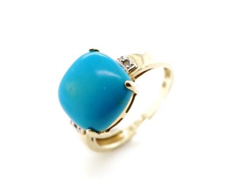 Turquoise and 10ct yellow gold ring marked 10k. Approx 3.3 grams, ring size N-O, 12mm cushion cut treated turquoise, loss to 