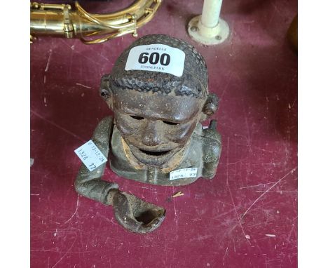 A vintage novelty cast iron money box Notice from the the-saleroom.com: These items are listed on the basis they are illustra