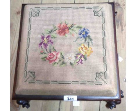 A late Victorian rosewood and pine framed footstool with square tapestry panel, set on scroll feet